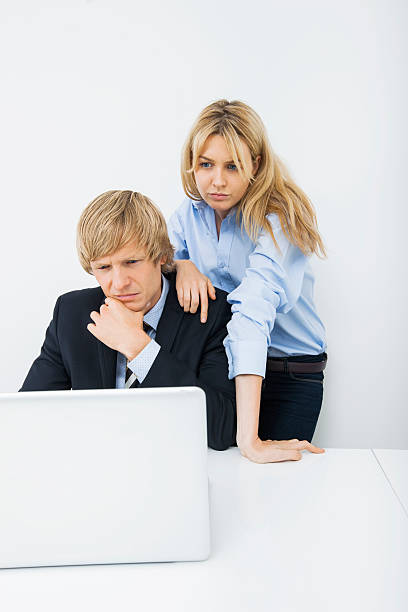 istock Businesspeople using laptop at desk in office 480267061