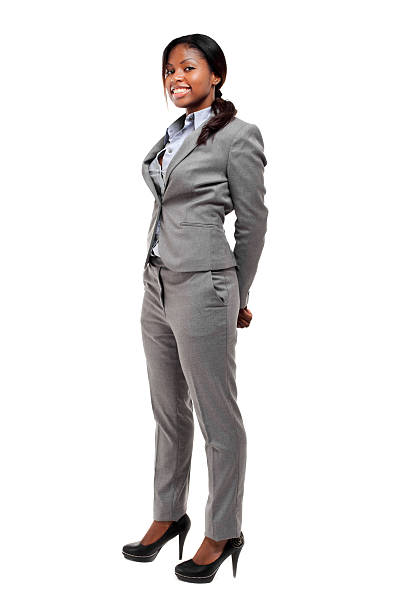 closeup portrait, girl in a business gray suit, shows sleeve buttons. Women's business suits made of high quality fabric. Advertising catalog photo of a female jacket, girl model shows sleeves close-up, business girl in a gray jacket, puts her hand in her pocket, with the other hand holds the lapel of a jacket made of quality fabric