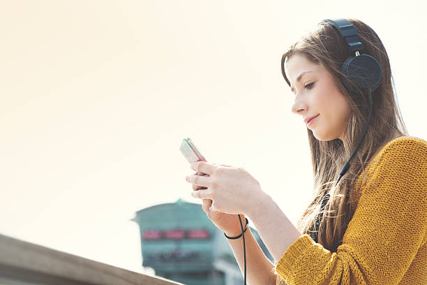 istock Woman videochats outdoor 480268516