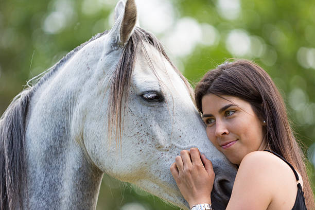 istock Young woman with her horse 480272078