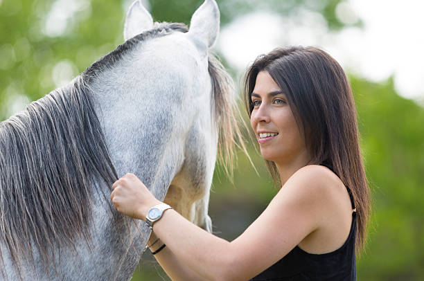 istock Young woman with her horse 480272082