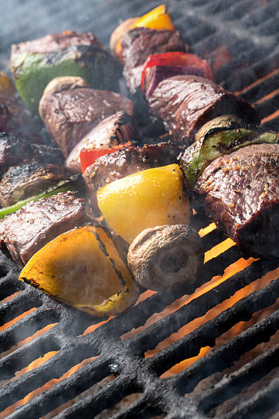istock Delicious Beef Shish Kebab on a Grill with Flames` 480275566