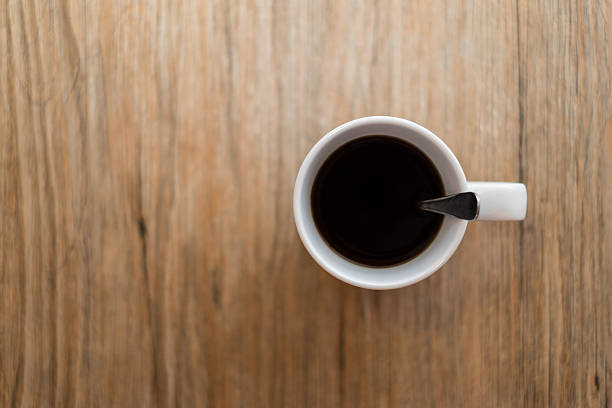istock Hot black coffee on wooden table 480275844