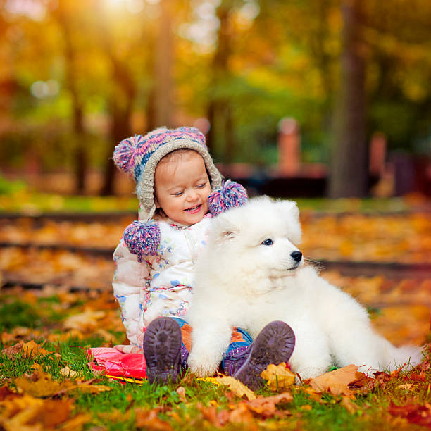 istock Child and puppy 480275906