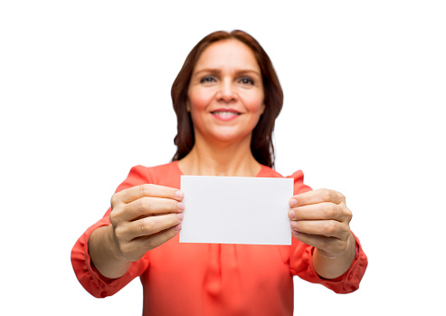 Portrait of a woman showing an empty business card and smiling isolated over white background