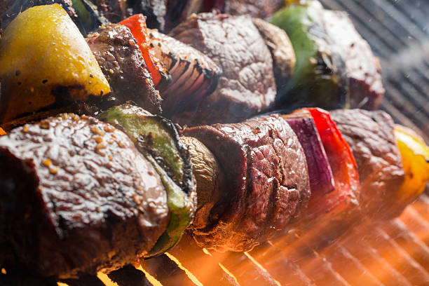 istock Delicious Beef Shish Kebab on a Grill with Flames` 480277420