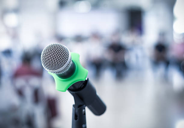 istock Close up of microphone in conference room on blurred background 480280428