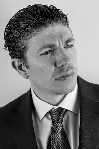 istock Headshot of attractive man in suit 480280654