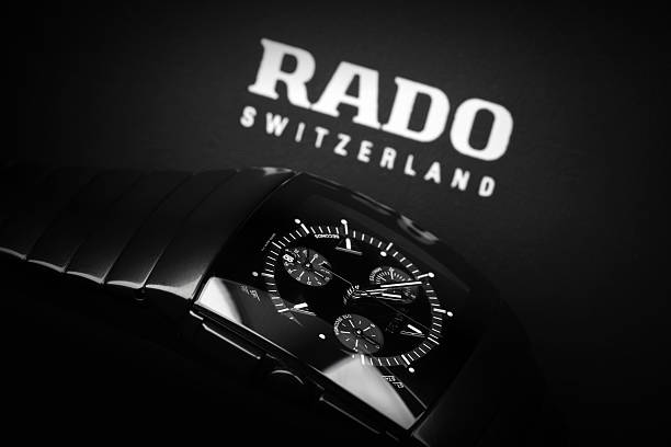 Saint-Petersburg, Russia - June 18, 2015: Rado Sintra Chrono, Mens chronograph watch made of high-tech ceramics with sapphire glass over black background with company logo. Selective focus