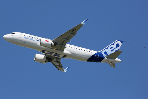 Toulouse, France - May 27, 2015: An Airbus A320neo with the registration F-WNEW taking off from Toulouse Airport (TLS) in France. The Airbus A320neo is the new short- to medium-range jet airliner developed by the European aircraft manufacturer Airbus.