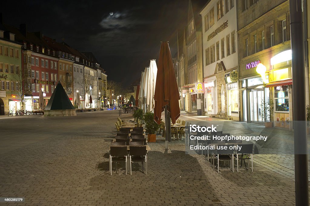 Centrum of Bayreuth Bayreuth, Bavaria, Germany - March 17, 2014: The market place (Maximilianstraße) of Bayreuth at night. Chairs and tables are outside from the coffe stores and restaurants but it`s to cold for outdoor. Bayreuth Stock Photo