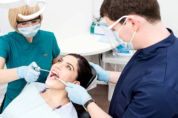 istock Young woman undergoing a dental check 480286690