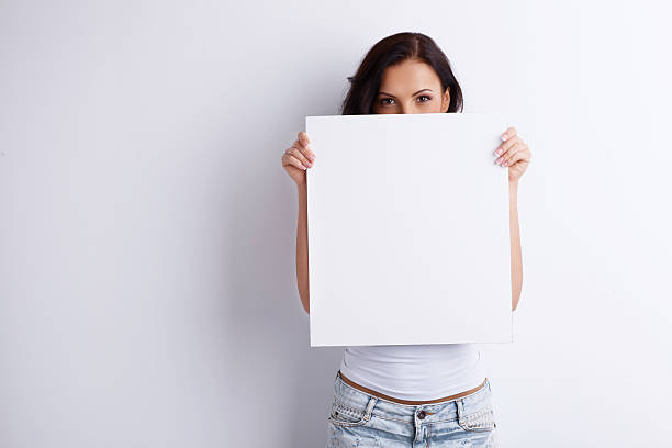 istock Beautiful healthy woman is presenting some empty picture 480287140