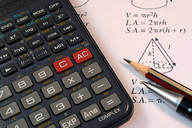 istock Eye Glasses, pen and pencil over the Formula with calculator 480288012
