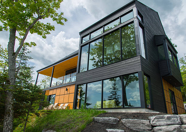 Stylish exterior of a contemporary two-story home with modern architectural features on an overcast day