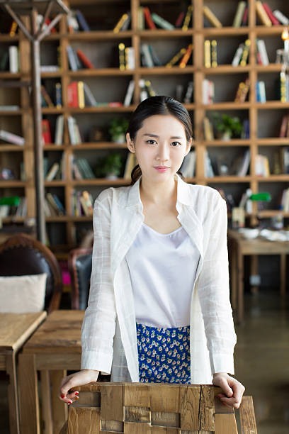istock girl standing in a bookstore 480288870