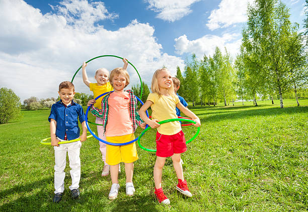 istock Happy children holding hula hoops during exercises 480288888