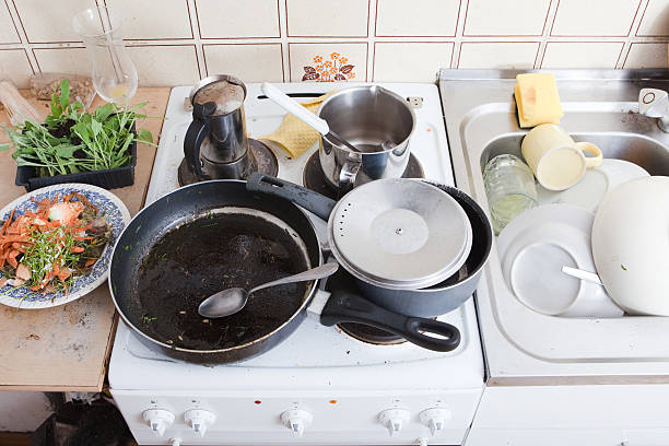istock messy kitchen in domestic household with grungy dishware on stove 480291778
