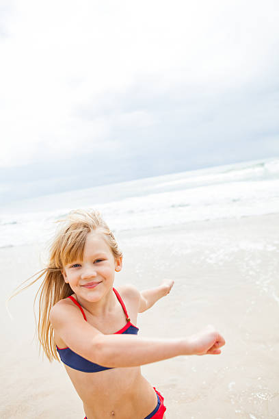 istock Young girl having fun at beach 480294001