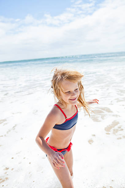 istock Young girl having fun at beach 480294057