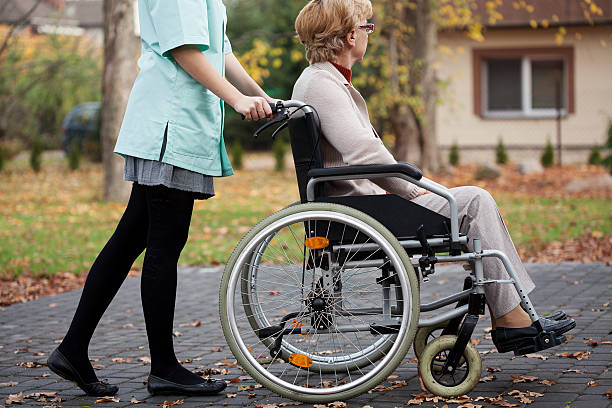 istock Caregiver and elder woman 480296107