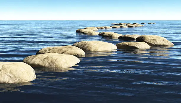 Photo of path of stones on the water