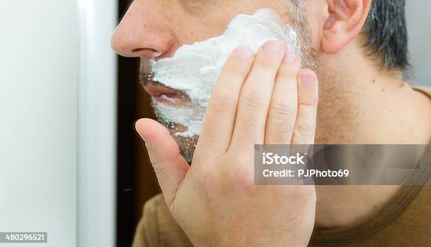 Closeup Of An Adult Man Shaving Using A Razor Stock Photo - Download Image Now - 40-44 Years, 40-49 Years, Adult