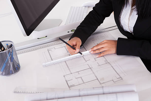 istock Close-up Of Female Architect Drawing Blueprint 480296951