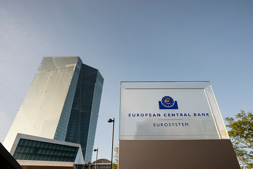 Frankfurt am Main,Germany - June 17, 2015: Entrance of the new European Central Bank. It is the headquarters of ECB  in Frankfurt, Germany.  In front you see the new sign of the Bank.