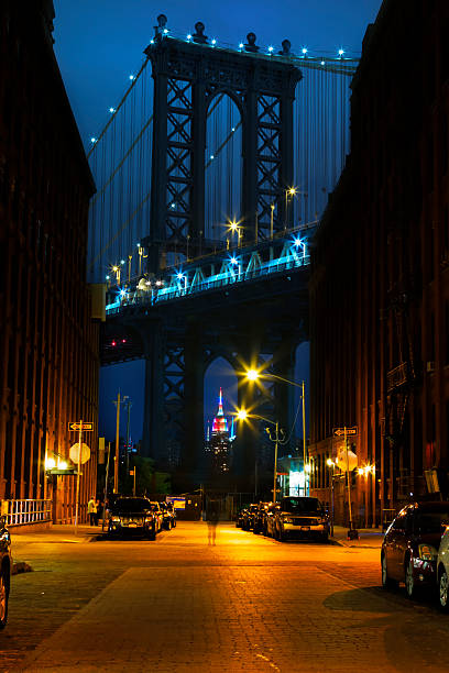 New York City at night. Bright lights of New York City at night. brooklyn bridge new york stock pictures, royalty-free photos & images