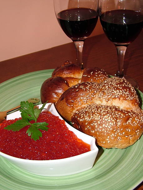 Red caviar, challah and two glasses of wine Red caviar, challah and two glasses of red wine judiaca stock pictures, royalty-free photos & images