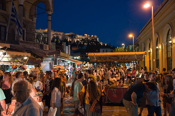 Nightlife in Plaka with Acropolis on the background. Athens, Greece. stock photo
