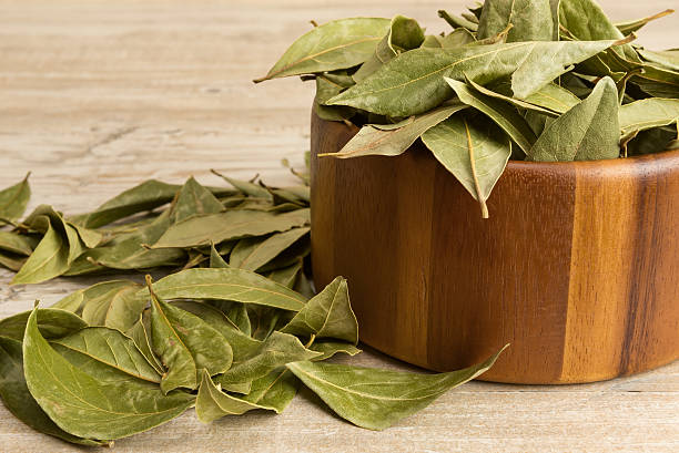 istock Dry bay leaves and wooden bowl 480298896