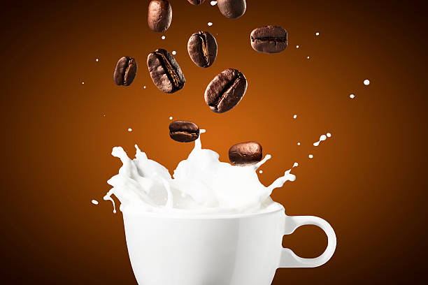 istock Coffee and Milk Splash With Coffee Beans 480299038