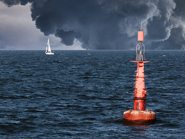 Red buoy Red buoy on water in a stormy day. punting stock pictures, royalty-free photos & images