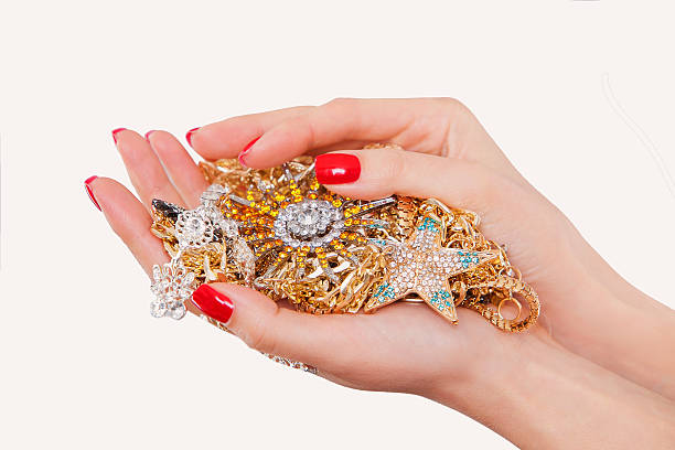 istock Hands holding expensive gold jewelry 480304126
