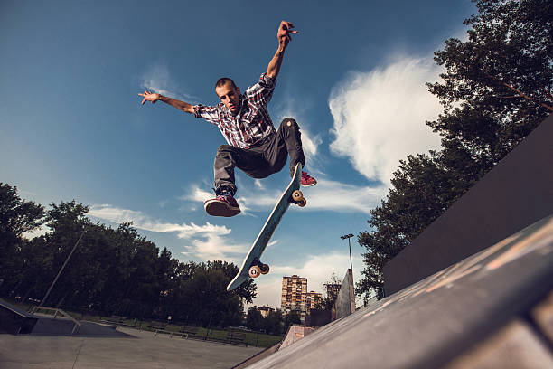 istock Below view of skillful skateboarder having fun at skate park. 480304256