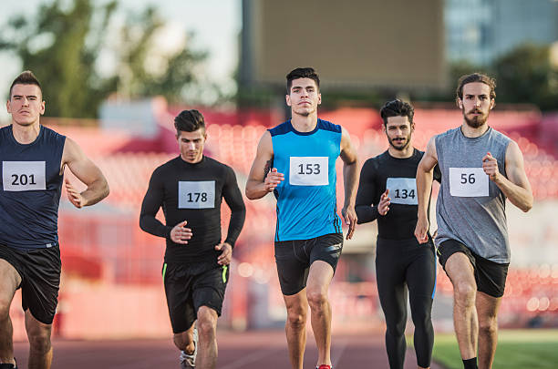 istock Young athletic team running a marathon on a stadium. 480304314