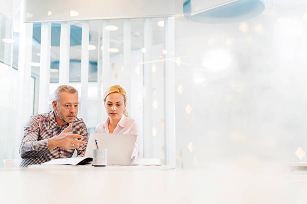 istock Two business people working together on laptop. 480304706