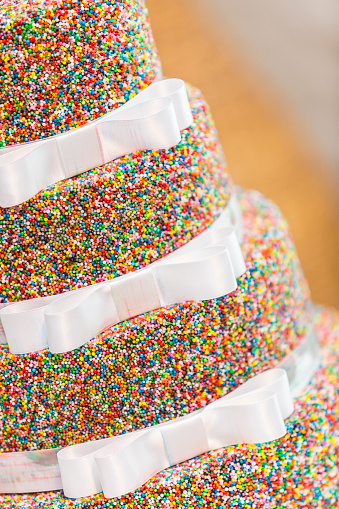 Wedding cake decorated with colourful hundreds and thousands