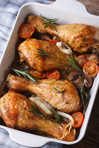 istock chicken legs with mushrooms in baking dish vertical top view 480305400