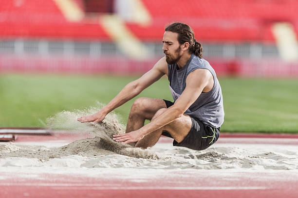 Professional Runner Training In The Stadium Track.