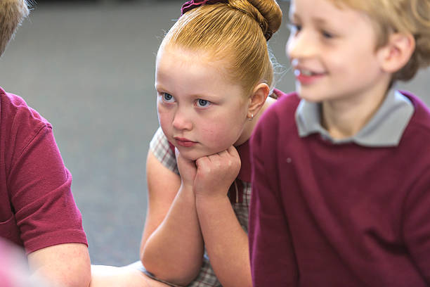istock Young Girl Sitting and Listening in Class 480310404