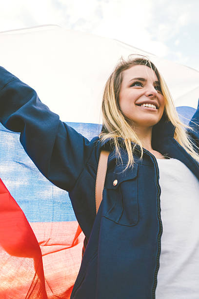 istock Cheering Woman Under Russian Flag 480310614