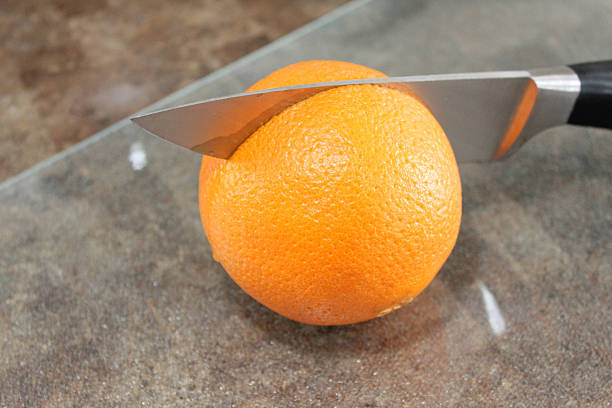 Orange and knife stock photo