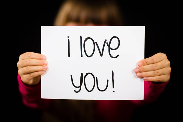 istock Child holding I Love You sign 480313954