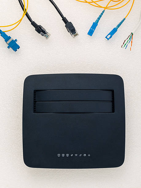 istock Above view of telecommunication connector with black router. 480314542