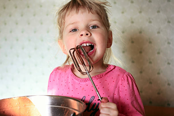 istock Girl licking beater 480315078