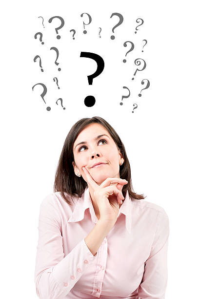 istock Beautiful girl with questions thinks above her head looking up. 480315573