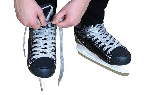 istock Tying laces on hockey skates 480316319